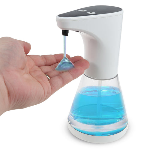 Hand under an automatic soap dispenser with blue liquid